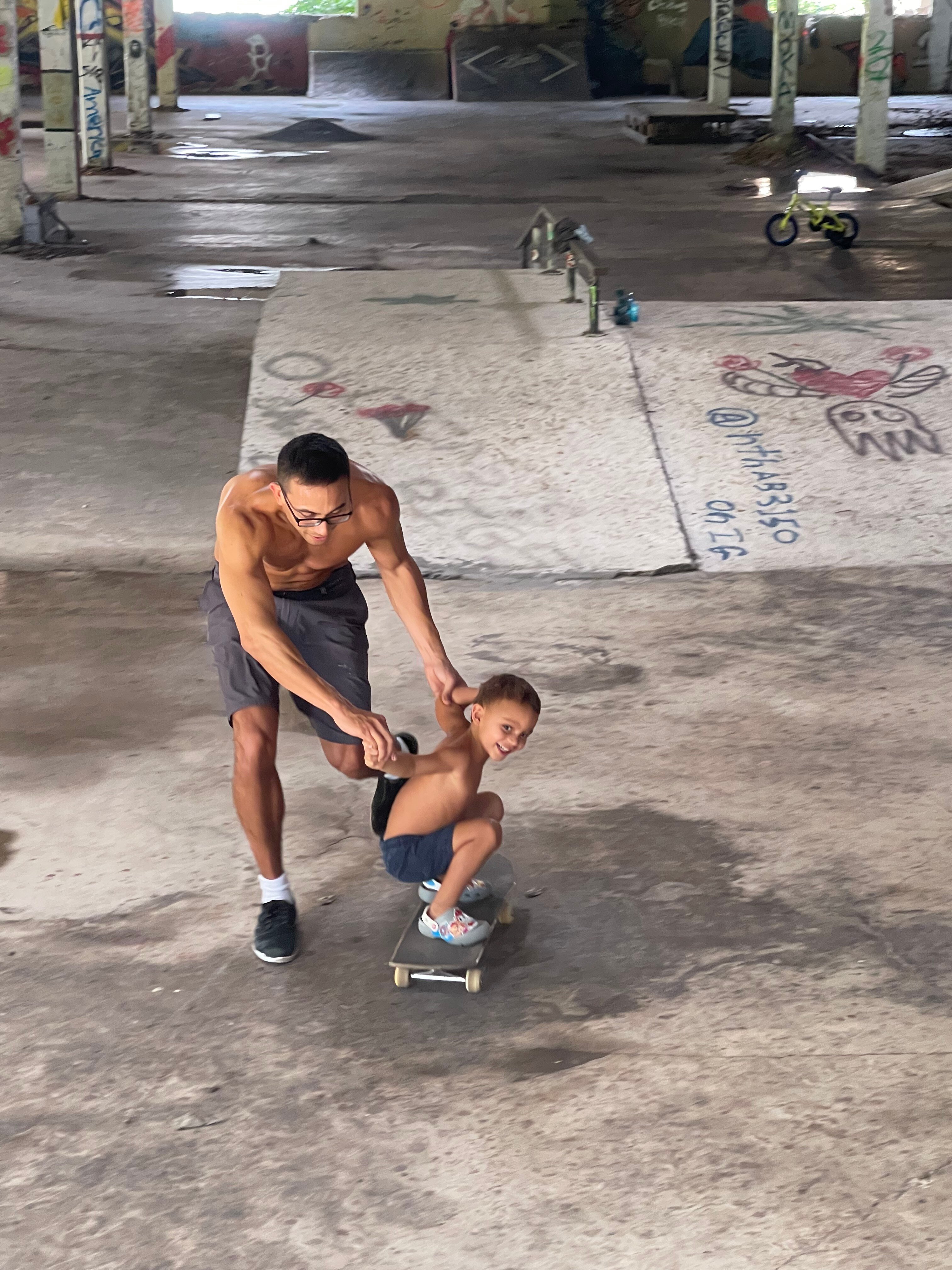 Skate dad Adam Pantin showing his son the ropes at The Warehouse in Chaguaramas