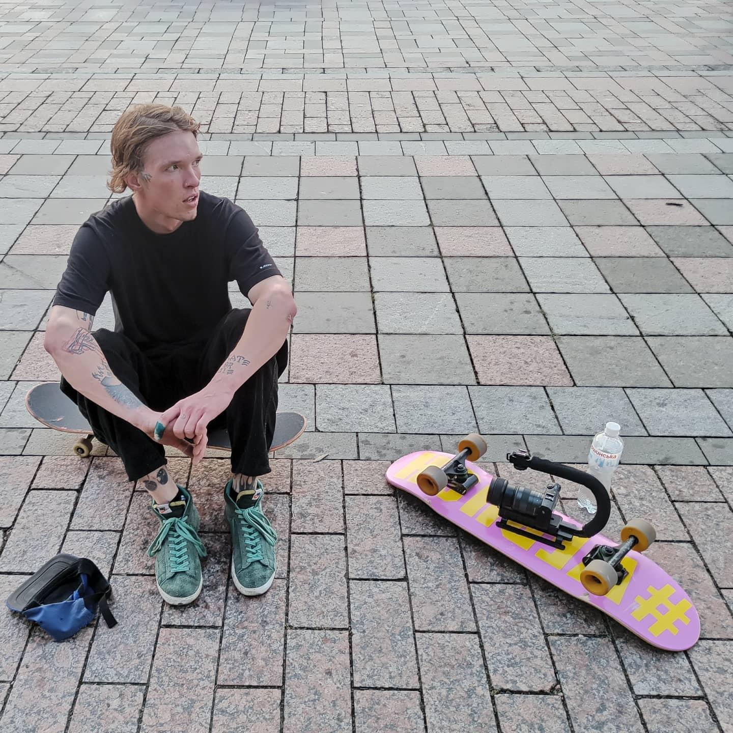 Vlad Timoshenko with camera and skateboard, photo by Dmytro Kyrylets