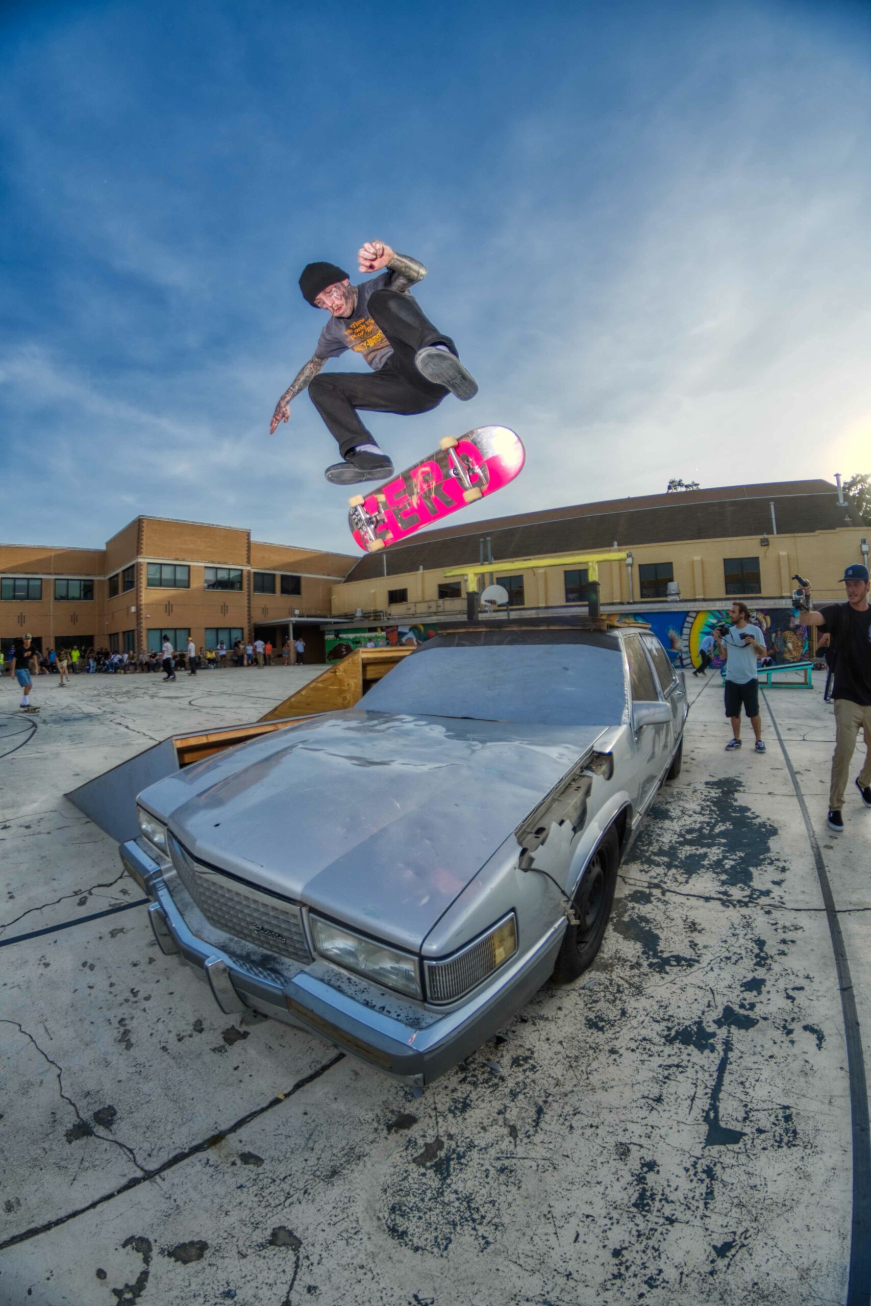 Light_Jake Watkins kick flip over a car at the 2022 Go Skate Day celebration in Orlando, Florida